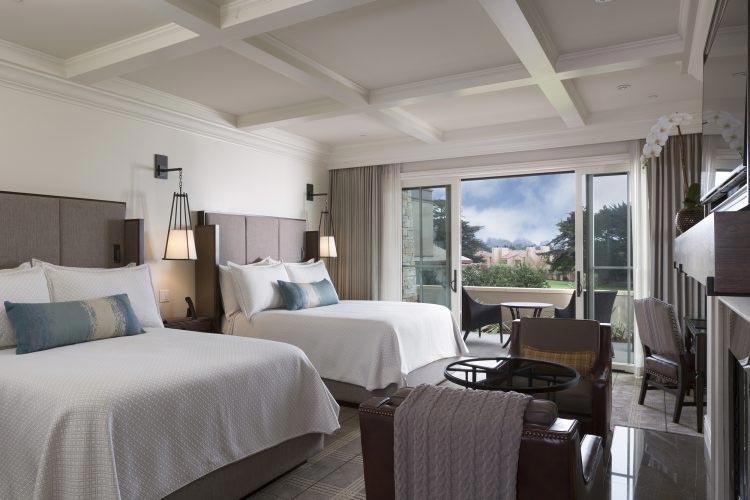 Spacious room with two beds and modern furniture