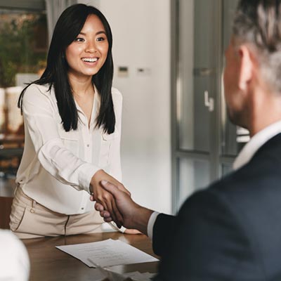 A man and woman shaking hands
